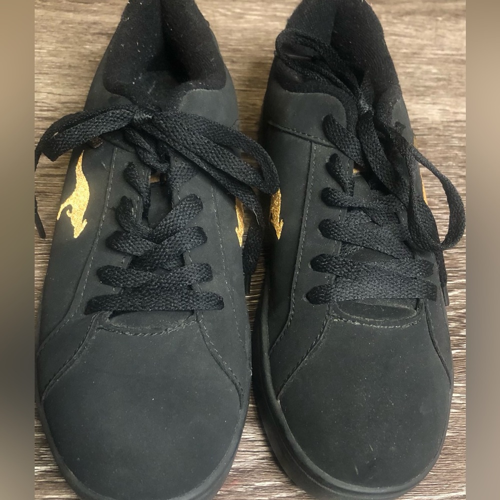 Women’s black and gold kangaROOS shoes